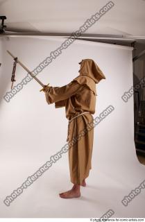 13 2018 01 PAVEL MONK STANDING POSE WITH SWORD AND…